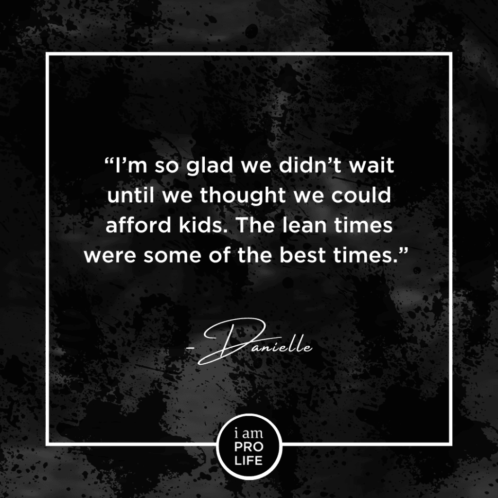 A black image with a faded ultrasound in the background. The foreground features white text that says: "I'm so glad we didn't wait until we thought we could afford kids. The lean times were some of the best times." - Danielle