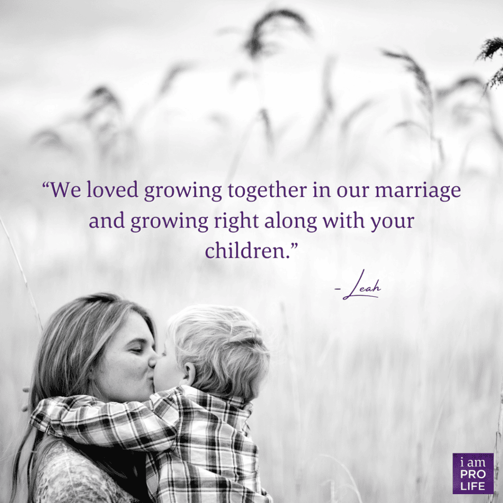 A white image of a mother holding and kissing her child in a field with the caption: "We loved growing together in our marriage and growing right along with your children". - Leah